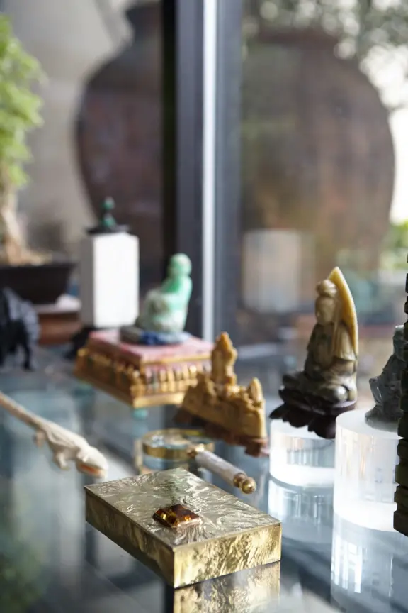 Jade Buddhas and a 1950s gold Tiffany box
