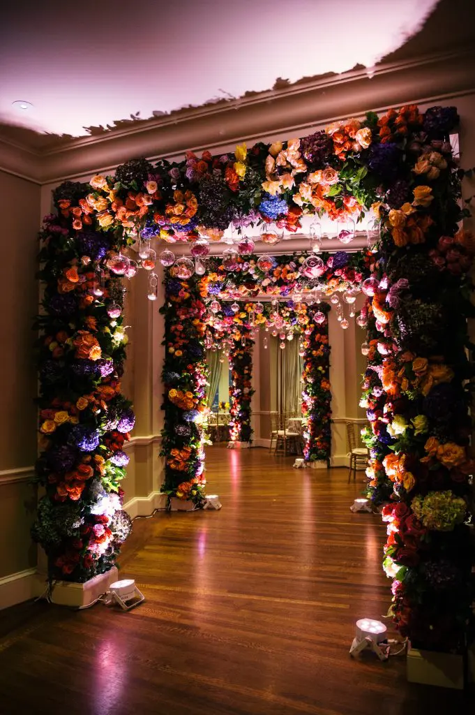 Richard Flowers creates a hallway of flowers at River Oaks Country Club for Jennifer McCord's wedding. 