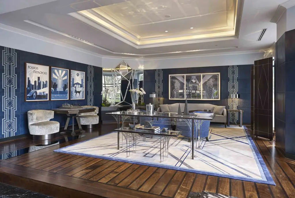 The lobby with blue leather paneled-walls with embroidery stitched by the same artisans that stitch Louboutin shoes. 