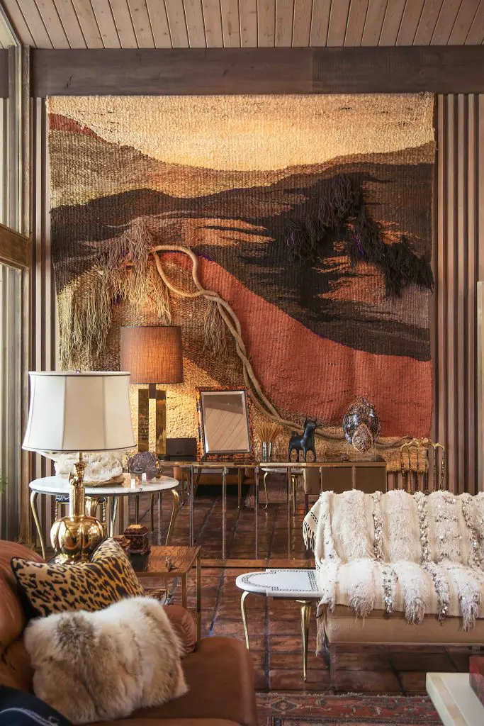 Large-scale 1970s yarn art from Scout Design Studio dominates a wall in the living area. Mirrored Ello credenza, circa 1970s. Italian side table, circa 1950s, from White Elephant. Moroccan wedding blanket. (Photo by Shayna Fontana)