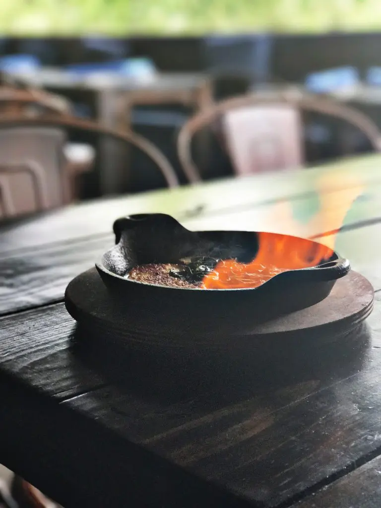Flaming cheese at Helen in the Heights
