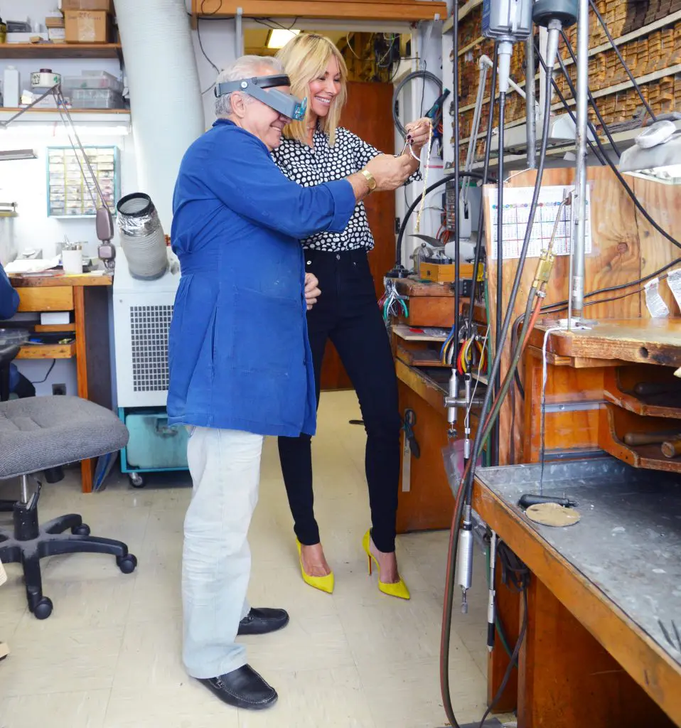 Katie Scott reviews her jewelry during manufacturing