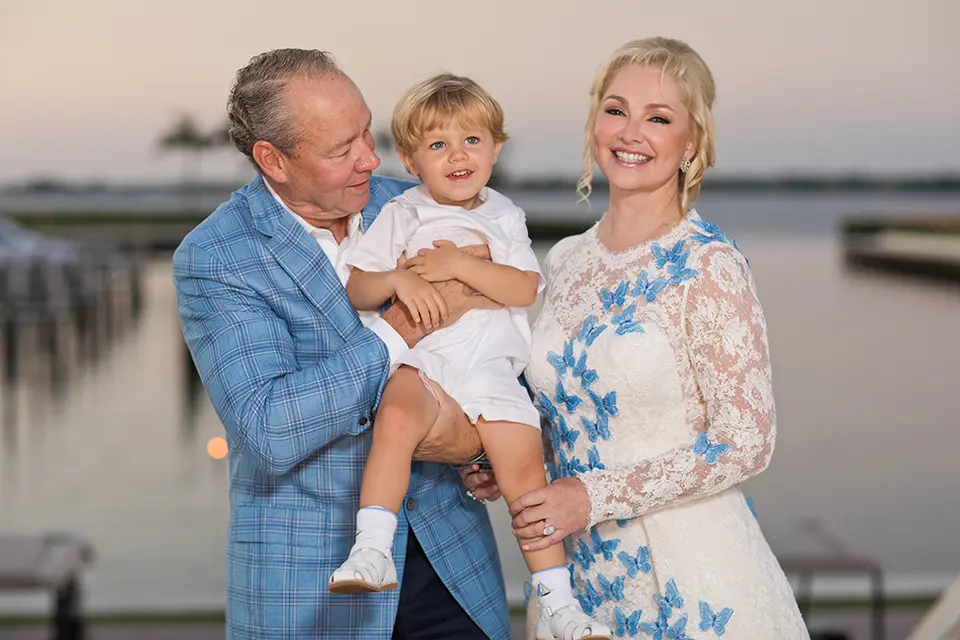 Jim Crane, Whitney Wheeler and their son James Robert Crane II have a moment on the big day.