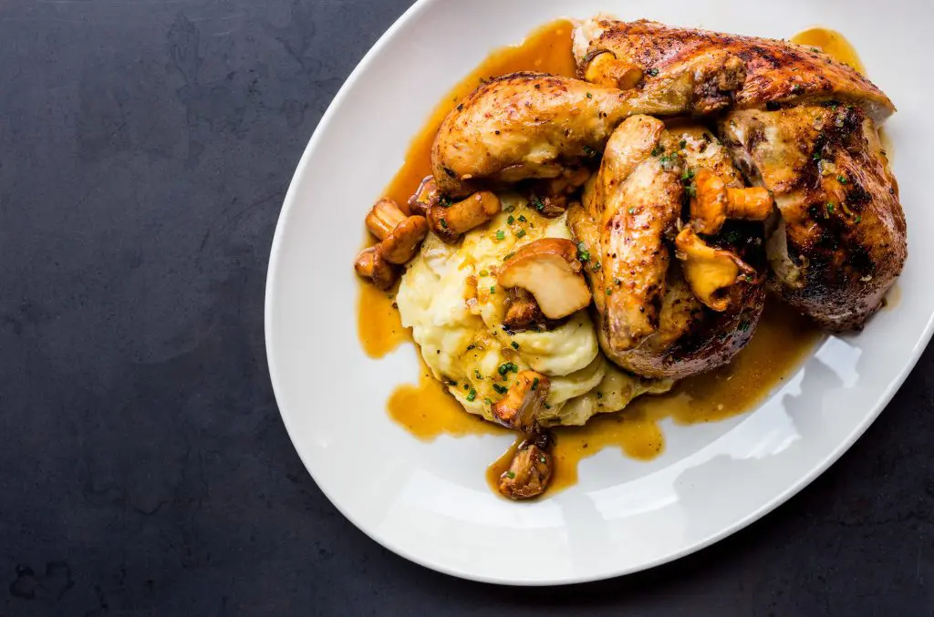 The roasted chicken is paired with chatrelles and a potato puree.