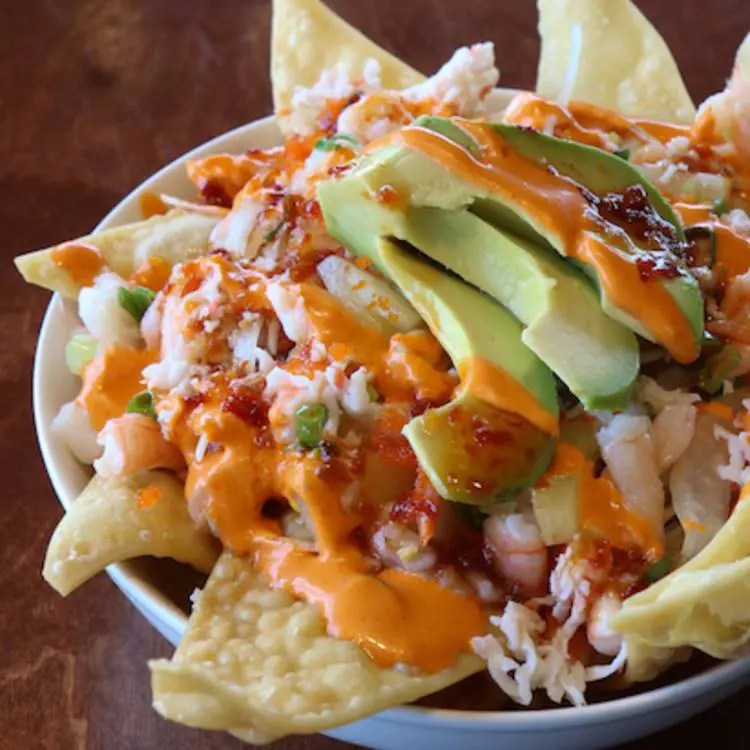Poke Bar is putting a twist on the classic poke bowl with raw fish nachos. (Photo courtesy Poke Bar's Facebook Page) 