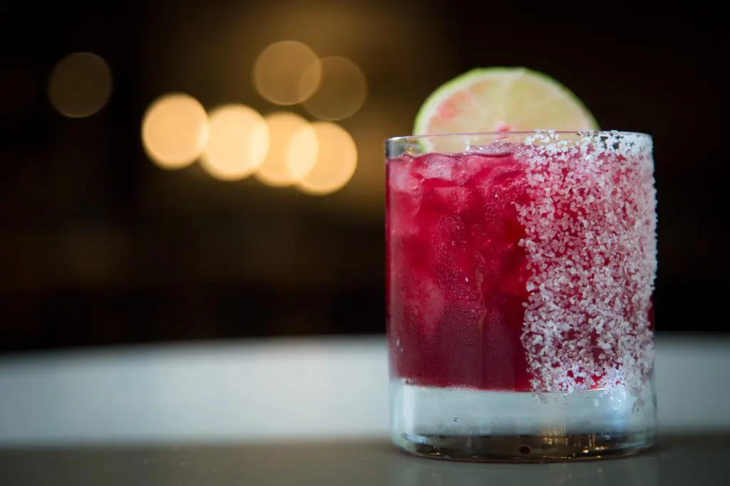 Stagecoach Inn beverage Director Topher White helps mix new drinks like the hibiscus margarita. 
