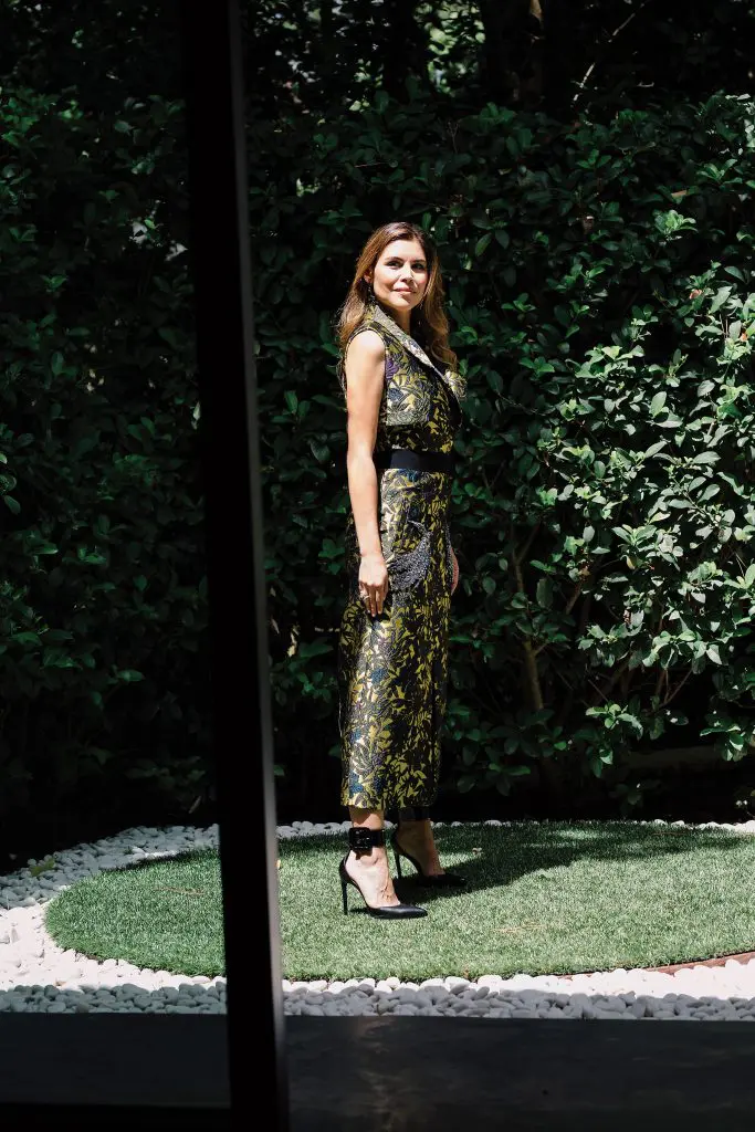 Cockrell in an Erdem sleeveless coat $3,210, at Forty Five Ten. 