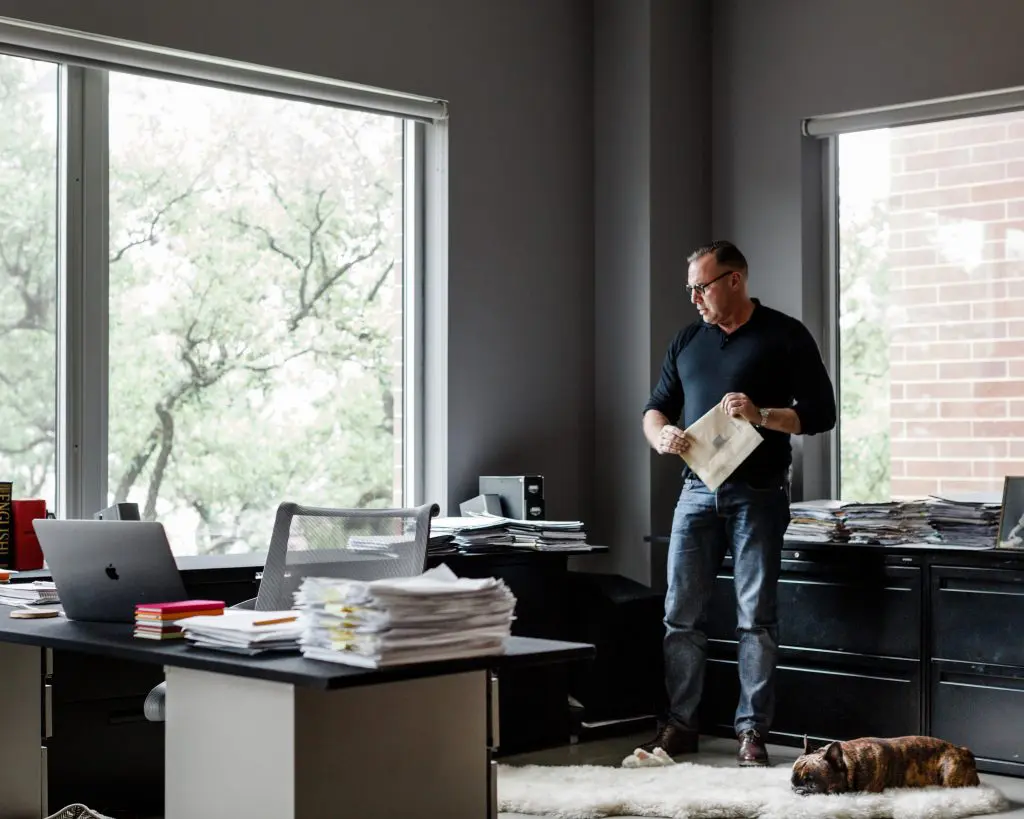 Contemplating research in a corner of a light-washed apartment transformed into a scholar’s office. Middleton based himself in Houston for more than 10 years, to conduct interviews and be near archives at The Menil Collection, and other primary source materials to gain insight into his subjects' lives. French bulldog Hubert, a muse for the author during his arduous writing process. (Photo Max Burkhalter) 