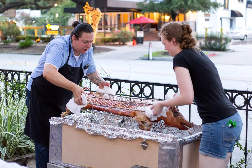 Edgar Hernandez and Martha De Leon flip the pig. 