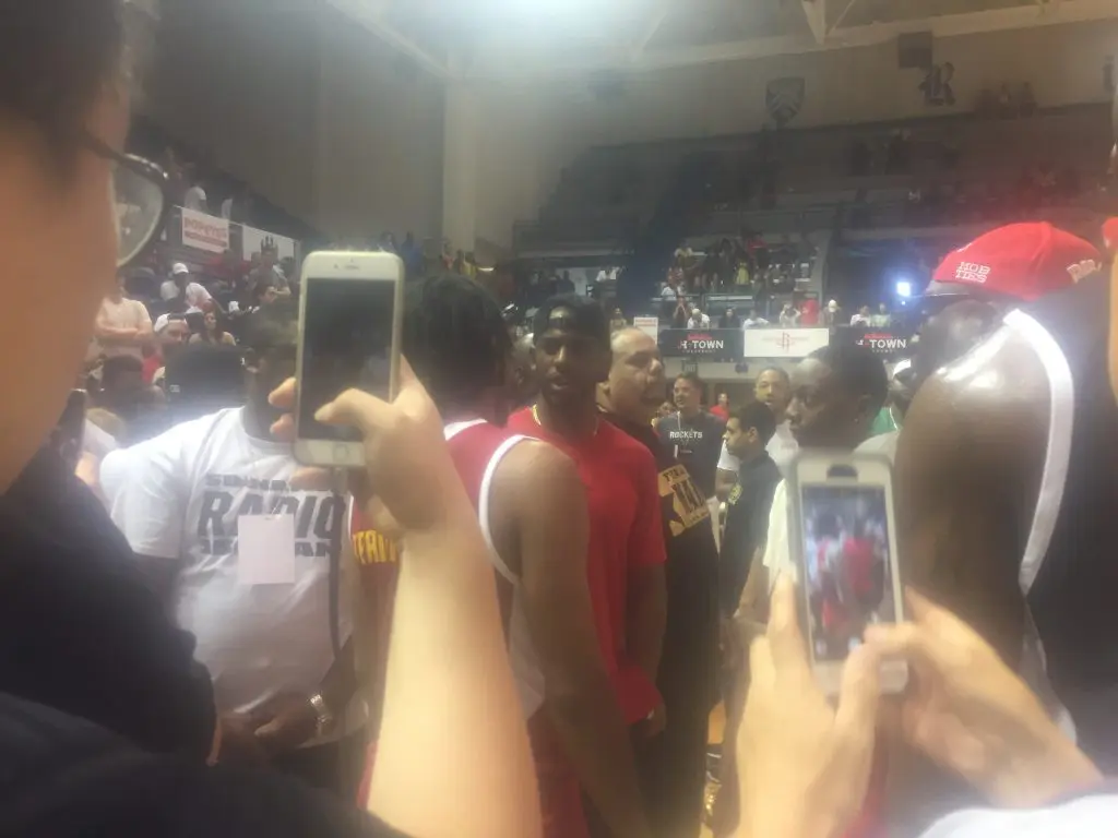 Chris Paul attracted a horde of would-be star grabbers when he walked into the gym. (Photo by Chris Baldwin.)