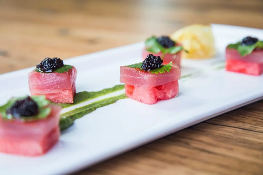 Watermelon & Tuna Sashimi topped with spicy soy caviar. 
