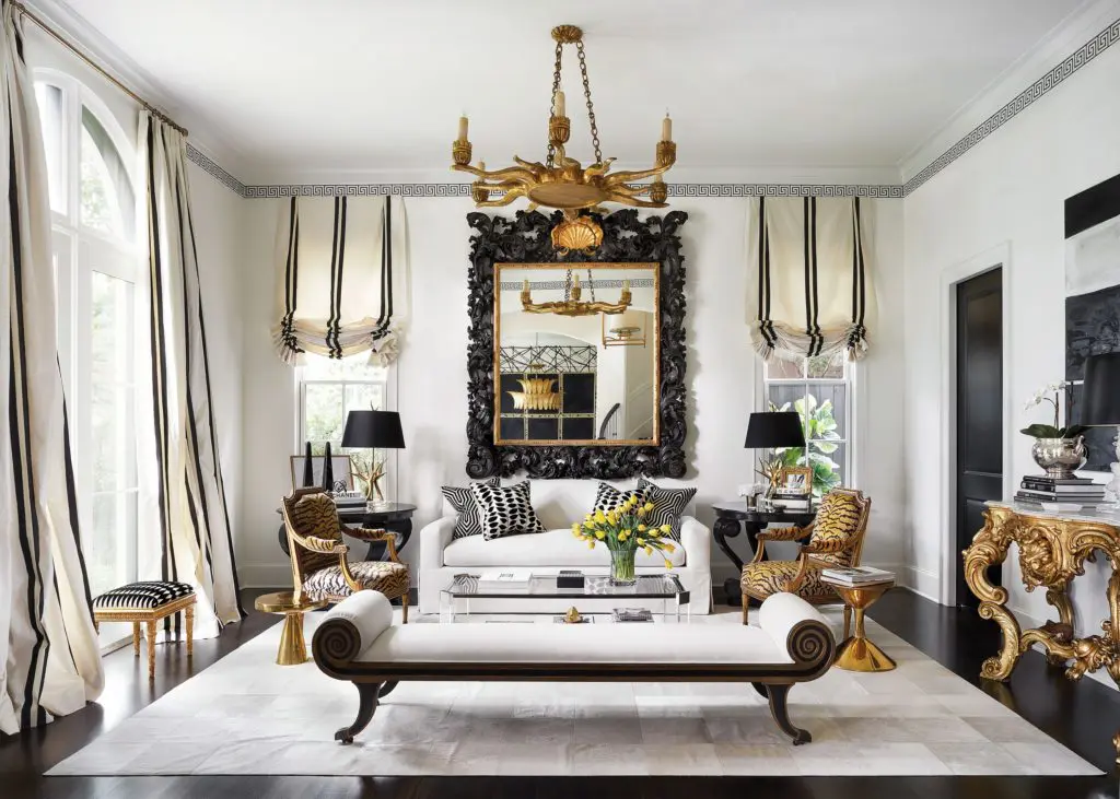 The living room, French Regency style daybed from Moxie. Mitchell Gold + Bob Williams Lucite coffee table, cowhide rug.