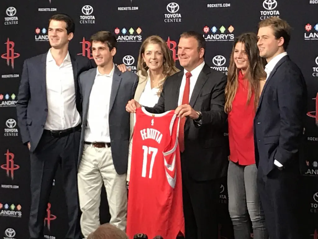 Tilman Fertitta enjoys a moment with his family at his introductory press conference as the Houston Rockets new owner.