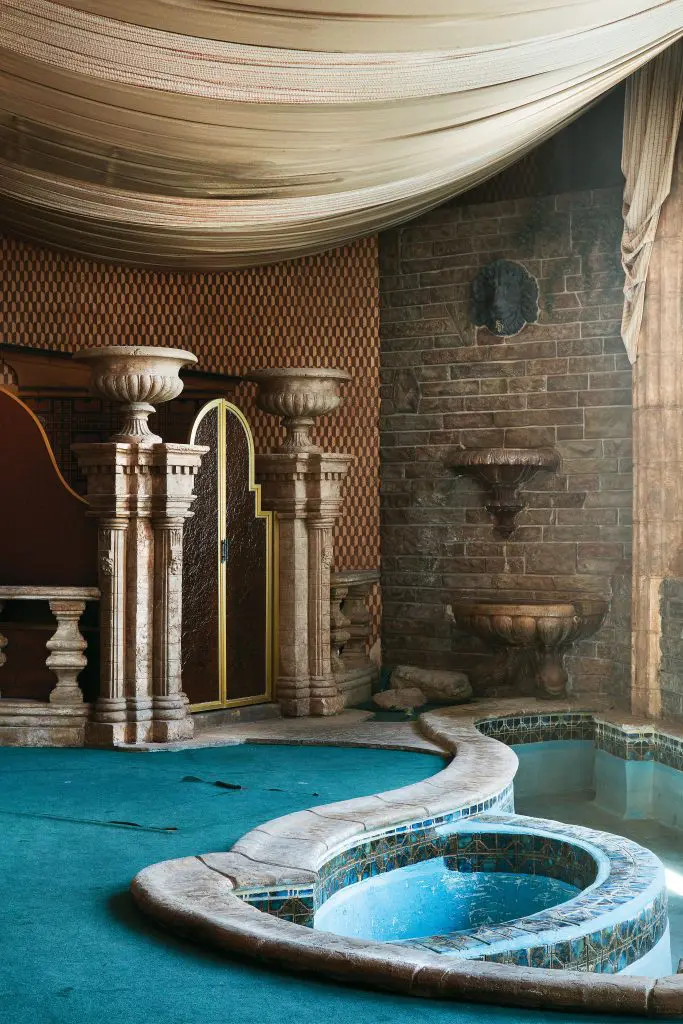 Channeling Pompeii in the Judge's private Roman Bathroom, including its 17-foot-long spa tub ringed by AstroTurf. 