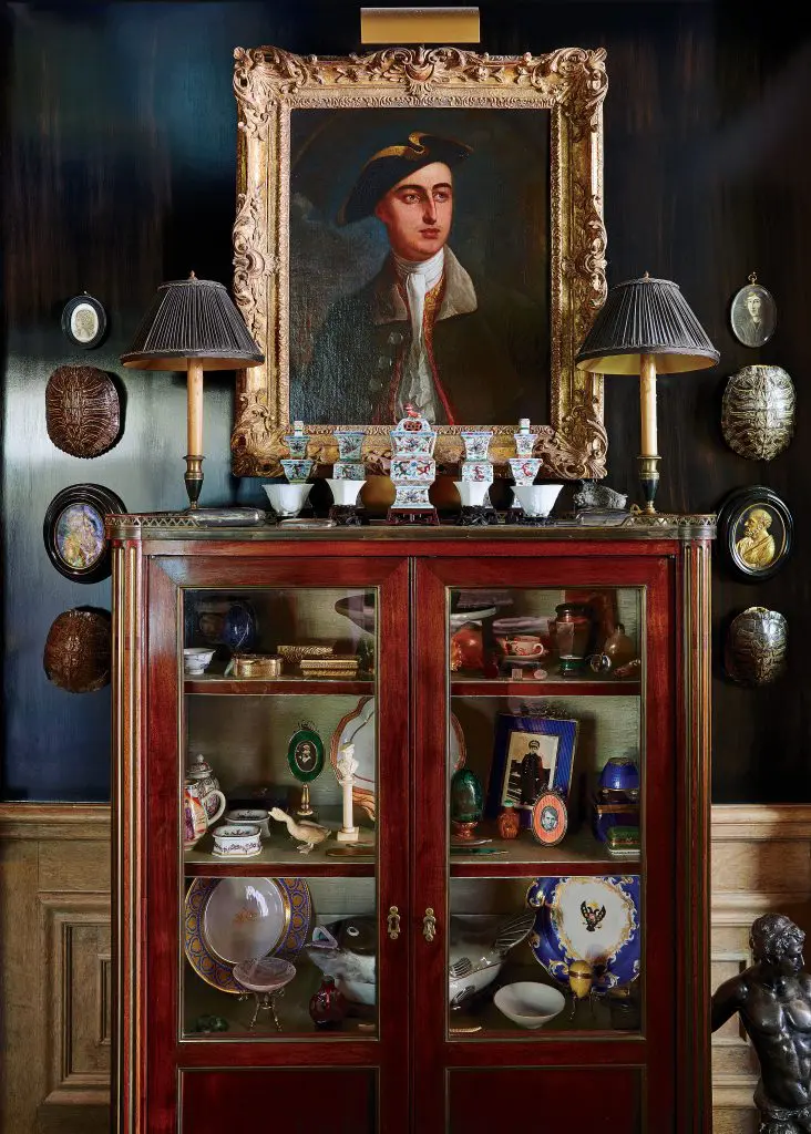 Collector's cabinet from A La Vielle Russie in New York City holds Russian objects and Chinese porcelains. 