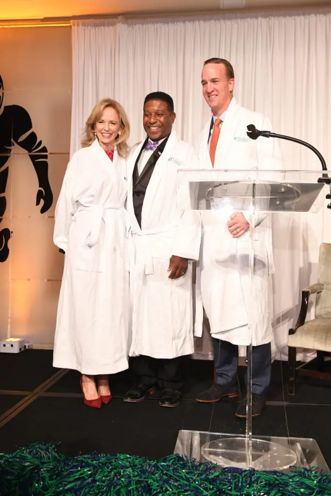 TEACH co-founder Susan Sarofim joined NFL stars Spencer Tillman and Peyton Manning on stage at the Touchdown for TEACH fundraiser at River Oaks Country Club in 2017. (Photo by Daniel Ortiz)
