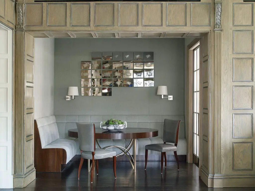 In the dining room, walls are upholstered in Pollock's strié velvet. Custom banquette. Client's own Art Deco chairs. Custom mahogany and silver-leaf table. Maison Charles sconces. Teresita Fernandez’s 30 Dissolves, 2011.