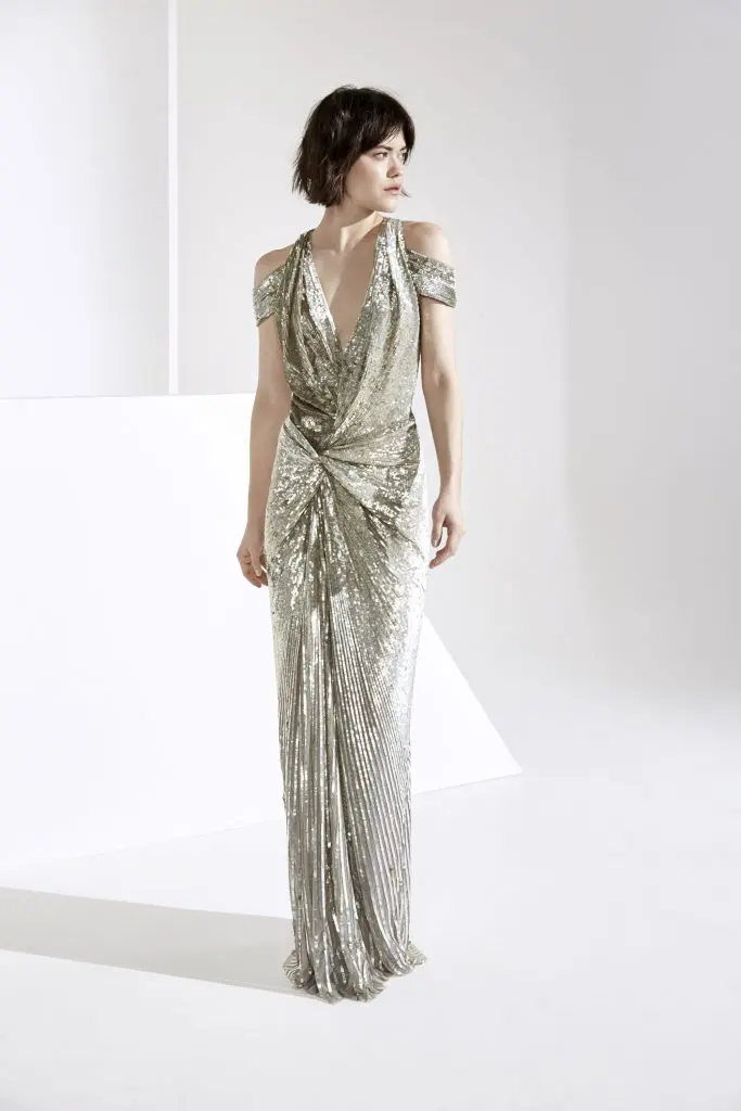 Jenny Packham metallic sequin draped cold shoulder gown.