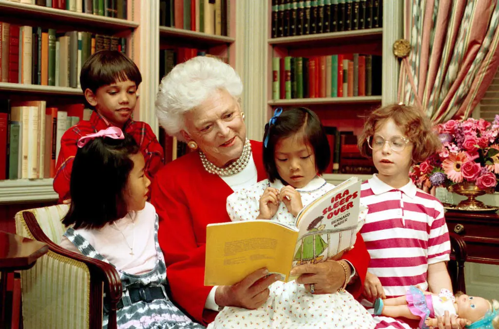 Barbara Bush often read to children in the White House Library.  And she still champions reading today.
(Photo Credit:  George Bush Presidential Center.)