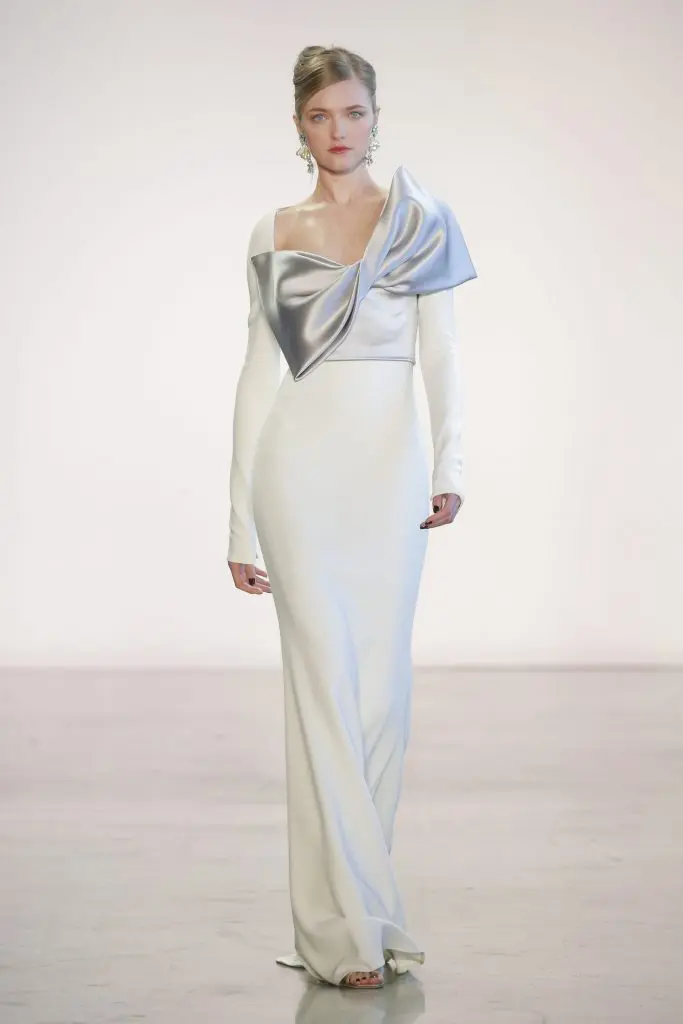 Badgley Mischka white crepe and dove satin bow evening gown.