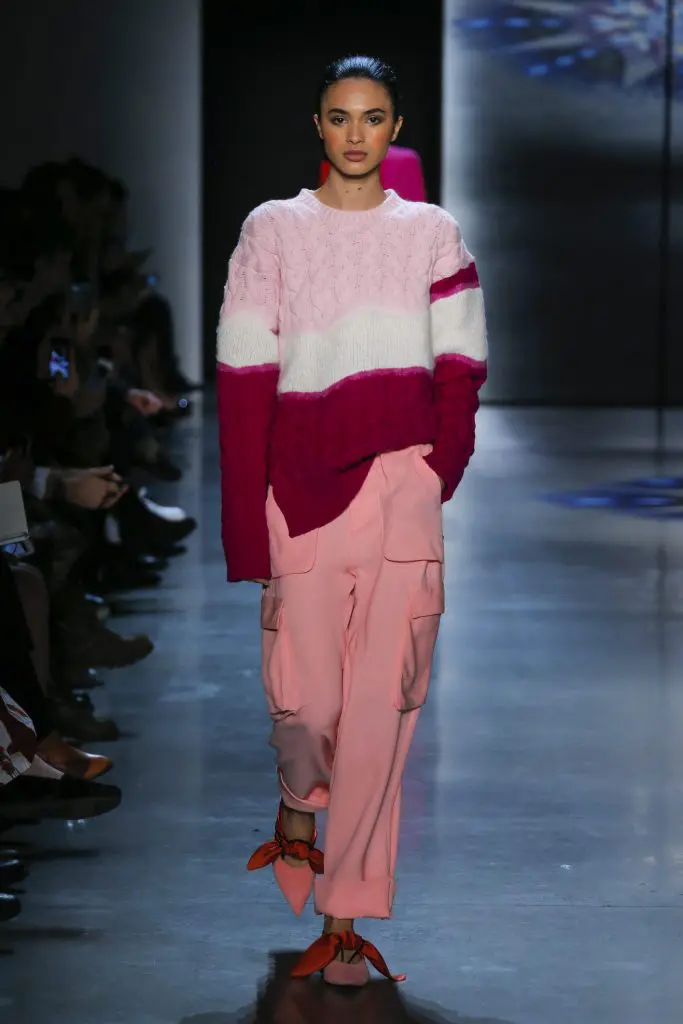 Prabal Gurung azalea wool crewneck sweater with engineered oombre needlepunch, pink cargo pants.