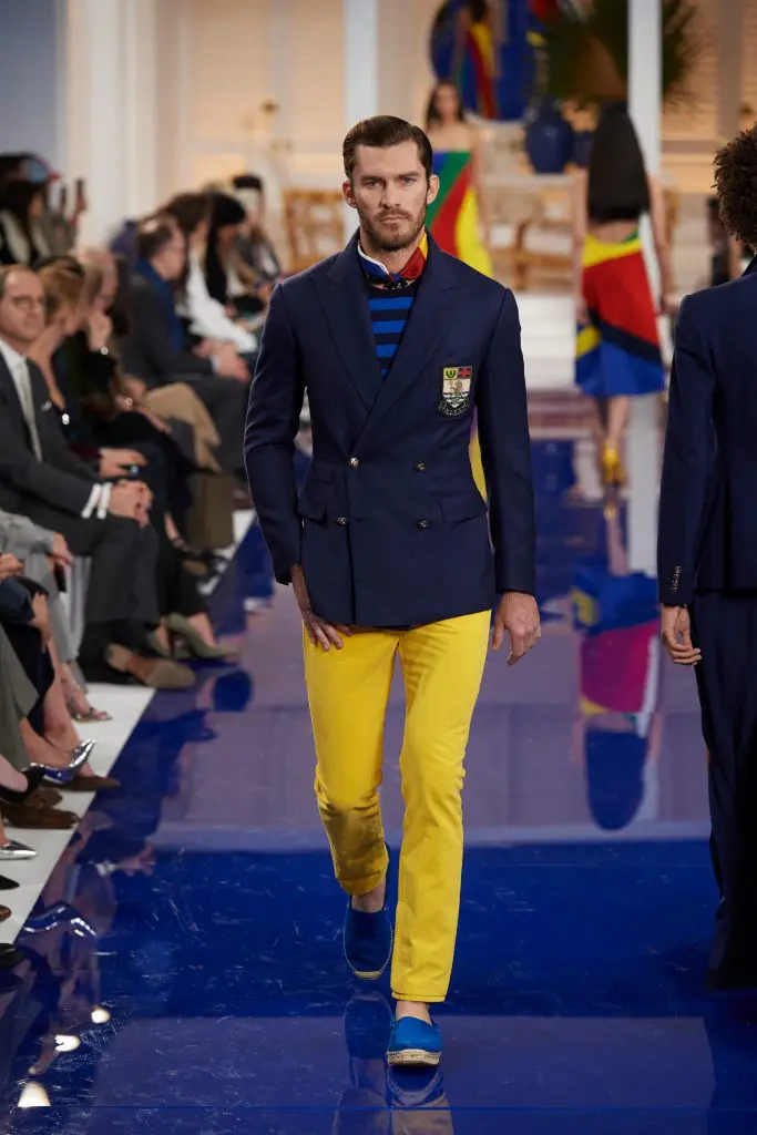 Ralph Lauren navy cashmere sportcoat, royal blue and navy cotton crewneck shirt, yellow cotton denim pant,
blue multi silk scarf.