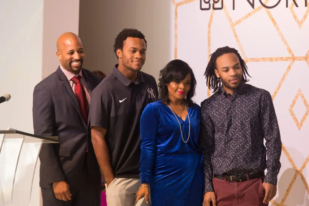 Shannon Ridley, Eli Alexander, Kimberly Alexander and Evan Alexander accepting Memorial hero Award for Elijah Alexander