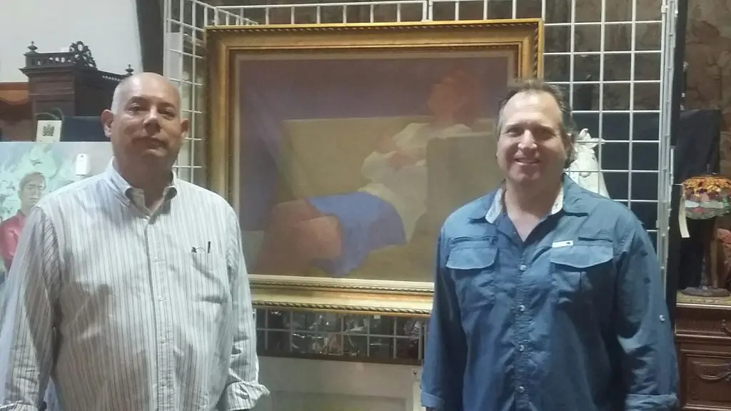 Ernest Maese and David Lewis with an early William Anzalone figurative canvas, from the estate of Bart Truxillo. The Houston auction house is continuing its tradition of auctioning significant art-world estates. (Another recent auction featured the collection of the late Jesús Moroles.)