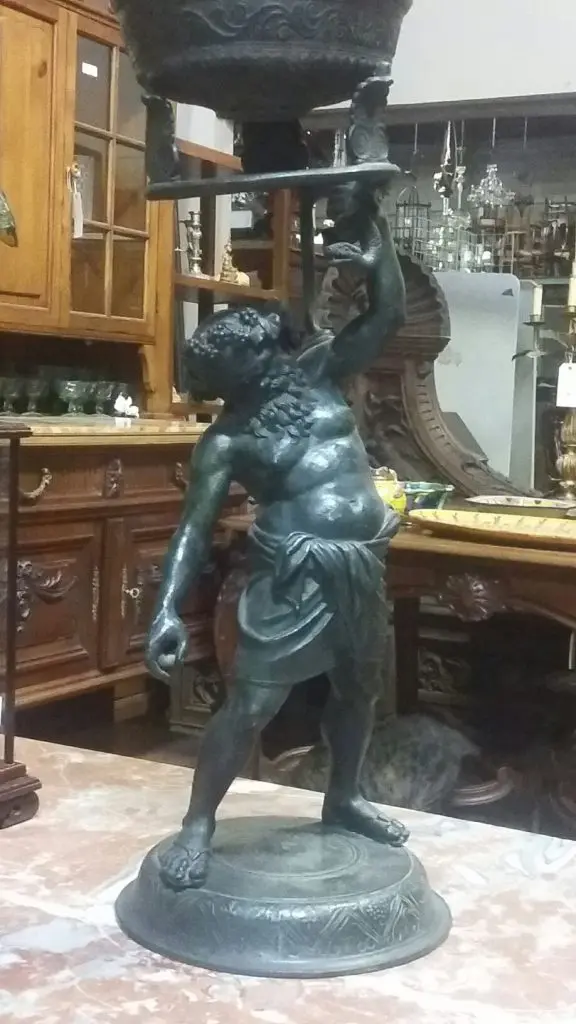 A Greco-Roman-inspired bronze of a drunken Silenus hints at Truxillo's ready wit and aptitude for entertainment. 