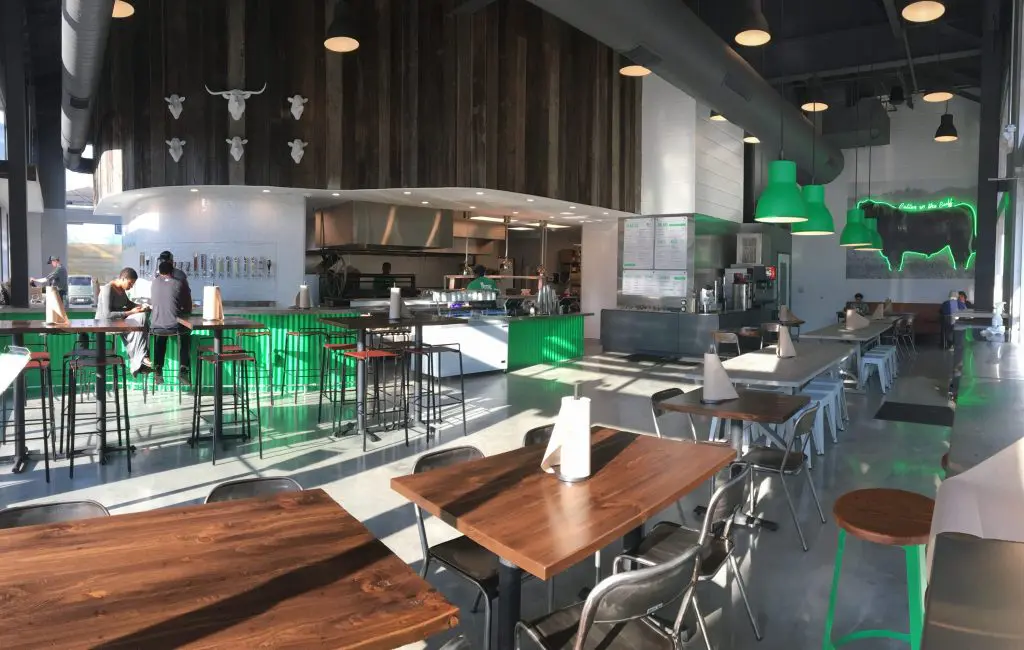 BuffBurger is decorated with reclaimed wood, metal accents and pops of Pantone 355 C. 