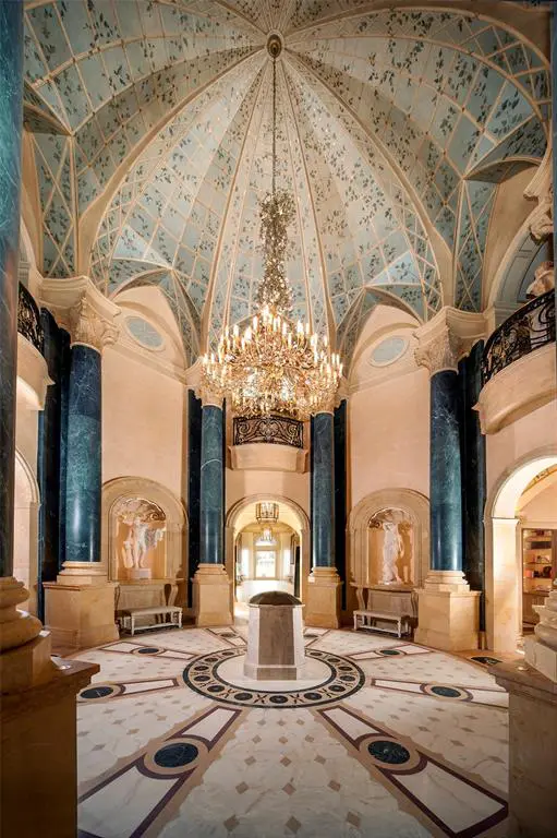 Dark blue marble accents complement this high ceiling in the 27,000 square foot  Chateau Cornarvon from which Marie Bosarge was ousted. 
