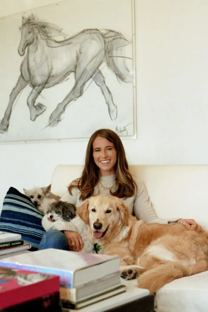 Isner lounges in her parents' Highland Park home with a few of the family pups (photo by Tony Krash)