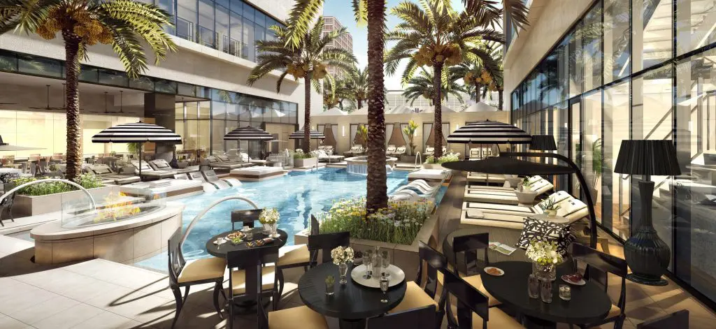 The Post Oak's lobby ends in a tall glass wall that looks out on the pool.
