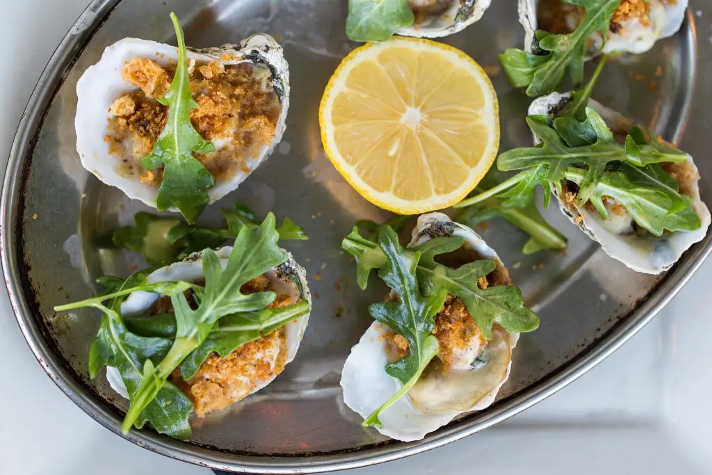Enjoy fresh oysters with creamy remoulade sauce at Hillside Farmacy. (Photo by Hillside Farmacy.)
