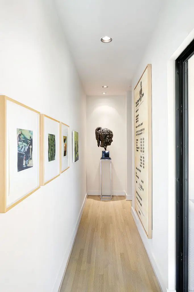 Kevin Francis Gray’s bronze sculpture "Louise", 2013, and to the left, Christopher Brown’s "Film Stills", 1994, and "Runner", 1994; Jose Maria Cano’s "The Groucho Club (We Are What We Pay For)", 2007.