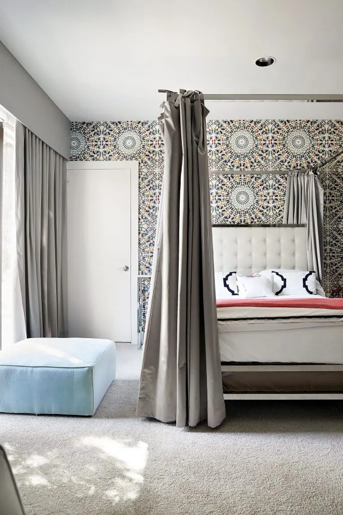 In the daughter’s bedroom, Damien Hirst’s "Etymology Wallpaper", 2010. Pottery Barn Teen ottoman.