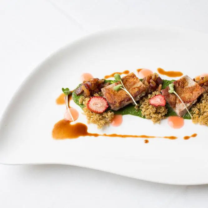 Cureight offers an eight-course tasting menu, with dishes like this Texas quail with bacon fennel Marmelatta. (Photo by Cureight.)