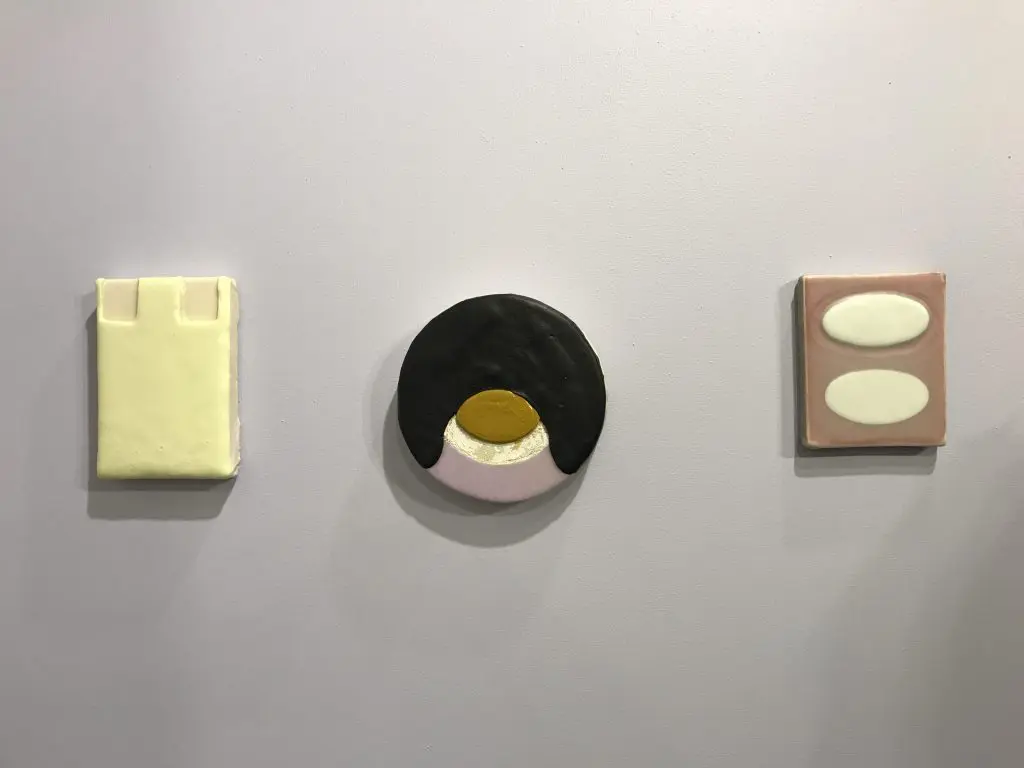 A wall of cheeky paintings by Bret Slater at Liliana Bloch Gallery, making her Dallas Art Fair debut.