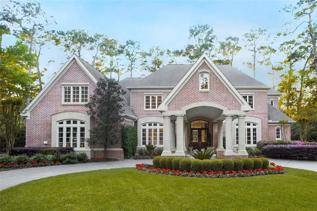 The Georgian-style home at 135 Hickory Ridge sits on a secluded 1.29 acre ravine lot. 