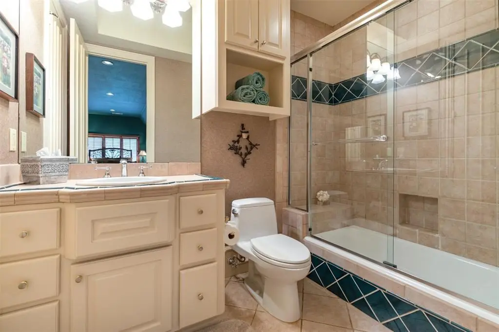 The fourth full bath offers a soothing shower experience with surround sound and tile floor. 