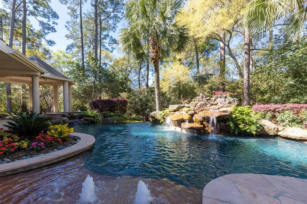 The infinity edge pool comes with a spa, fountain and rock waterfall. 