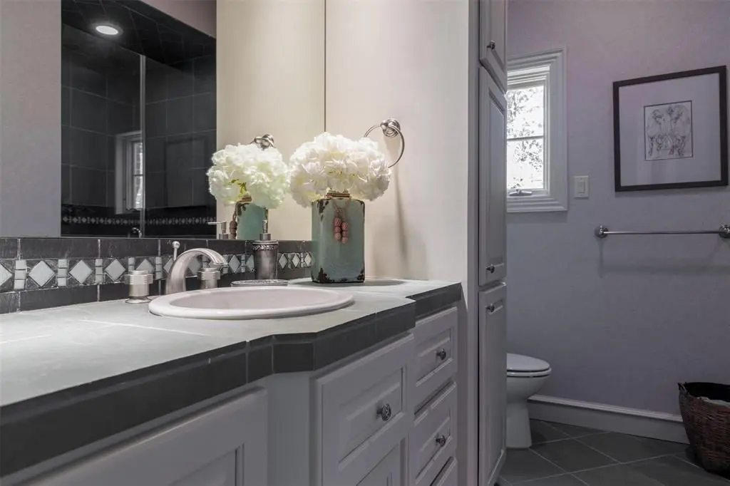 Slate tile counter tops add a nice touch to the second full bath. 