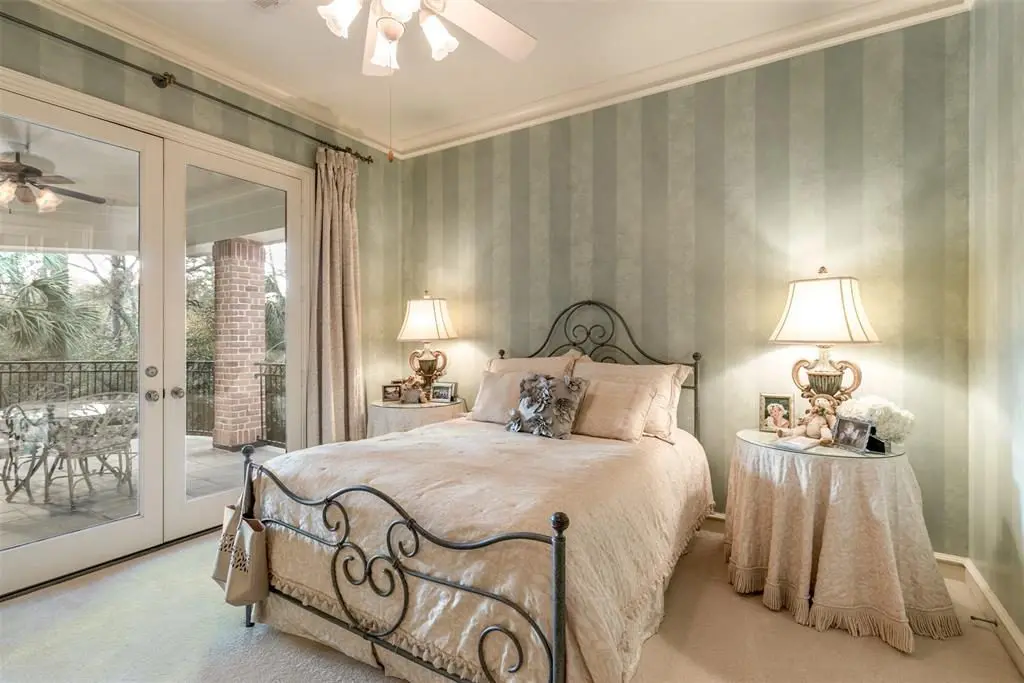 Double doors open up to the upper balcony outside the third bedroom. 
