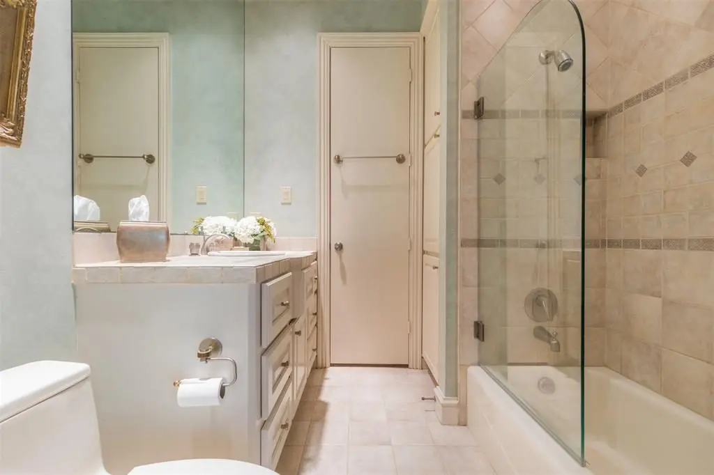 The third full bath shares a door with the game room hallway. 