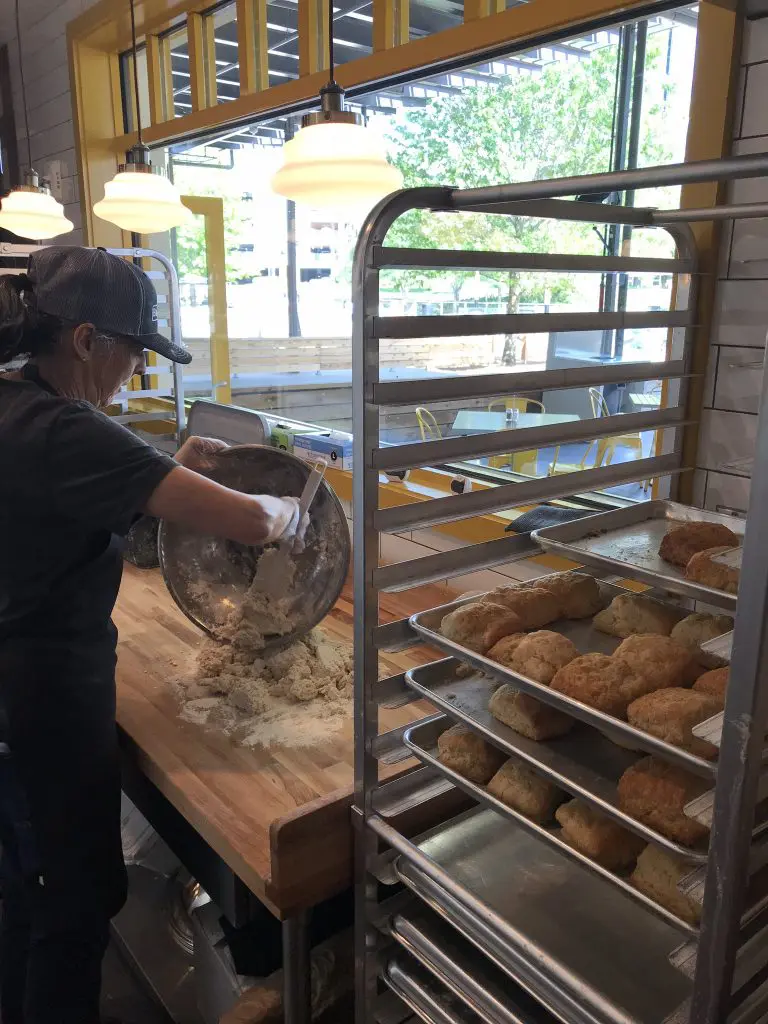 You can watch as biscuits are kneaded and made fresh daily at Dallas' The Biscuit Bar.