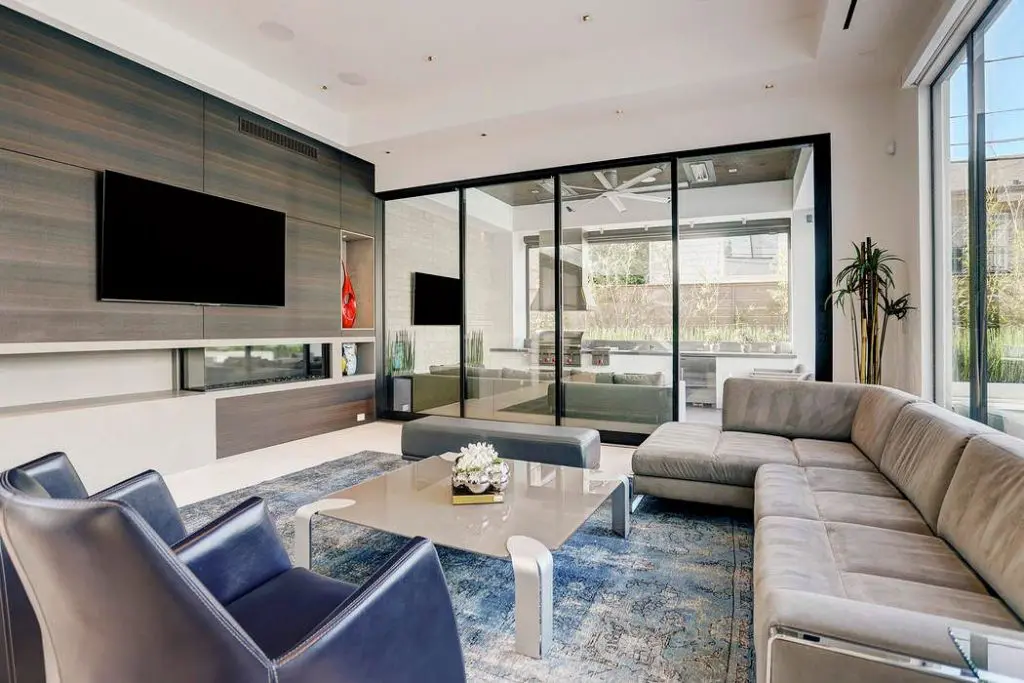 The den is welcoming and spacious with double-height ceilings. 