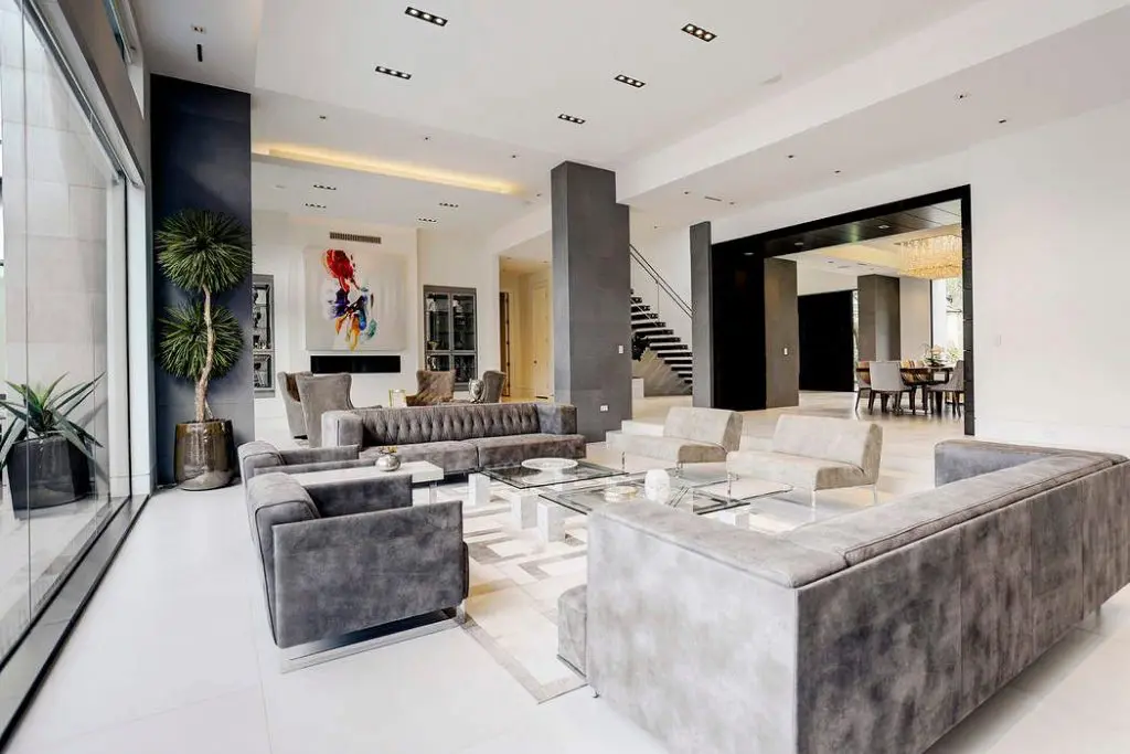 The living room offers tranquil views of the backyard and patio. 