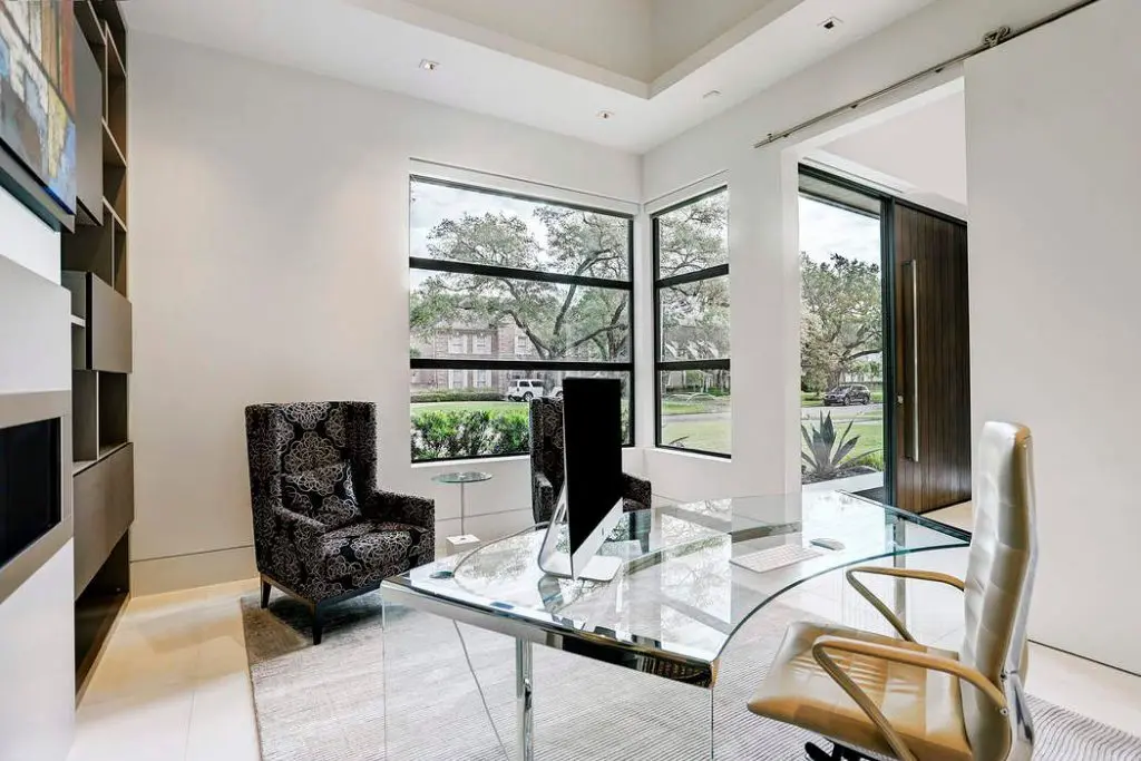 The study has lovely storage space, with bespoke Eggersmann cabinetry around the linear fireplace.