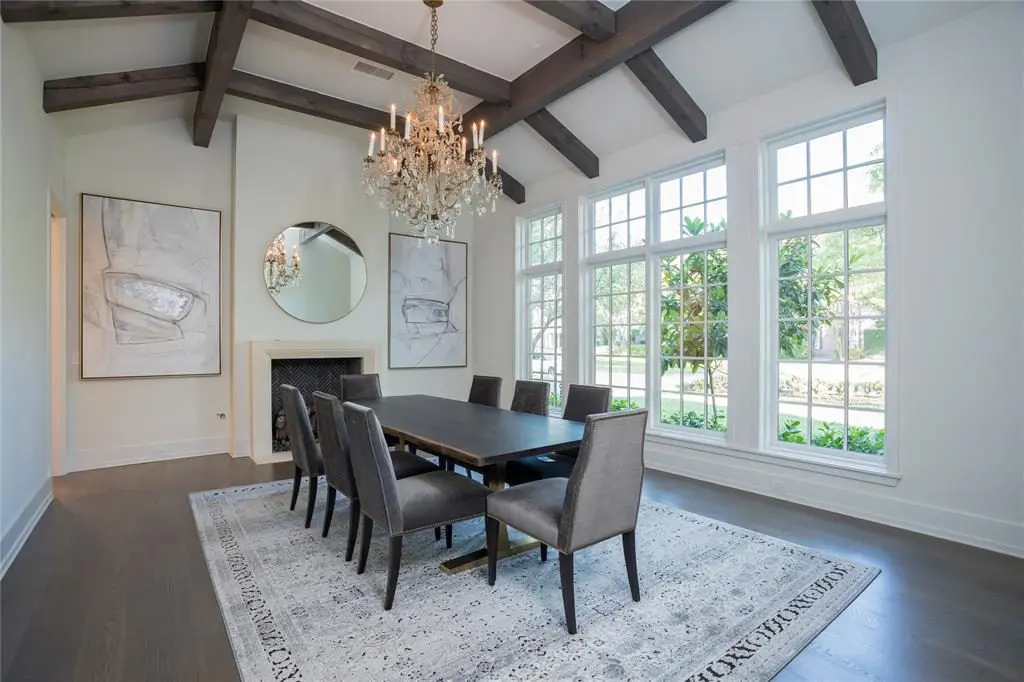 The oversized crystal chandelier in the formal dining room was imported from France, fitting with the tall windows. 