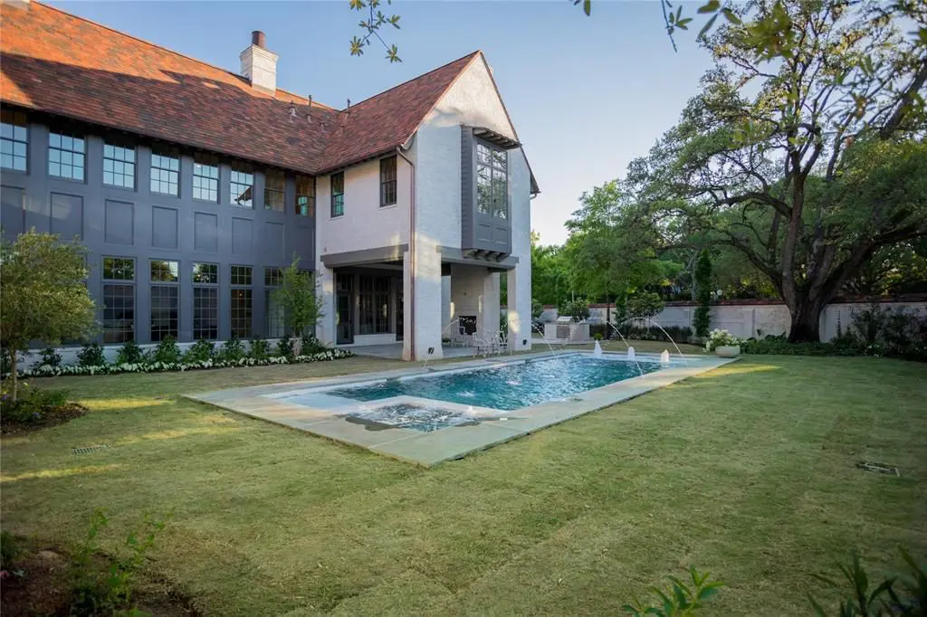 Gorgeous landscaping is reminiscent of Old River Oaks gardens. 